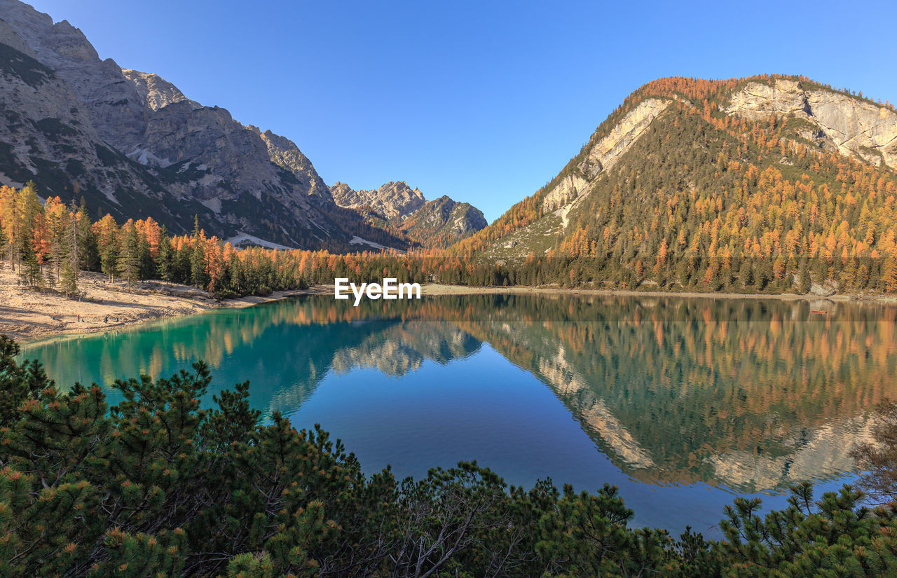 Scenic view of lake and mountains against sky