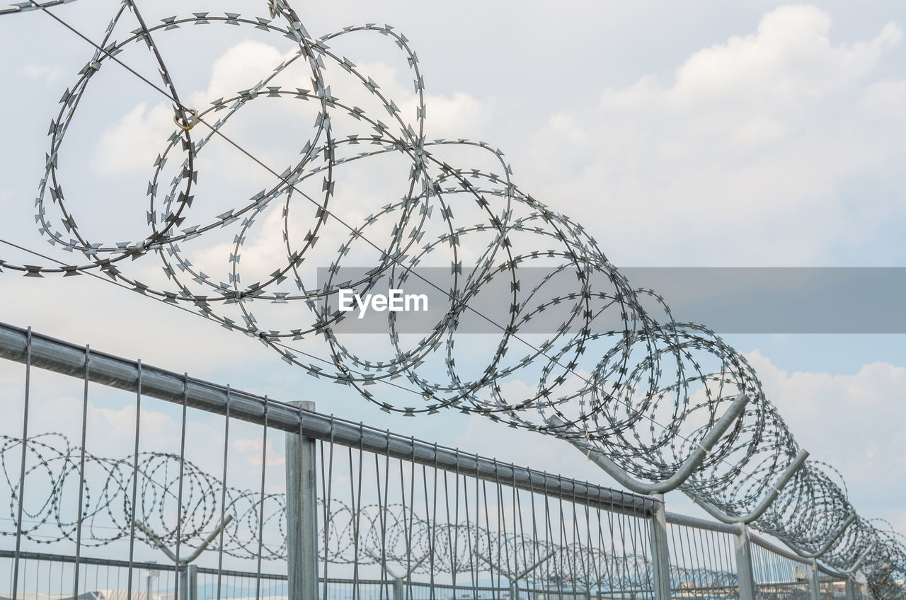 LOW ANGLE VIEW OF FENCE AGAINST SKY