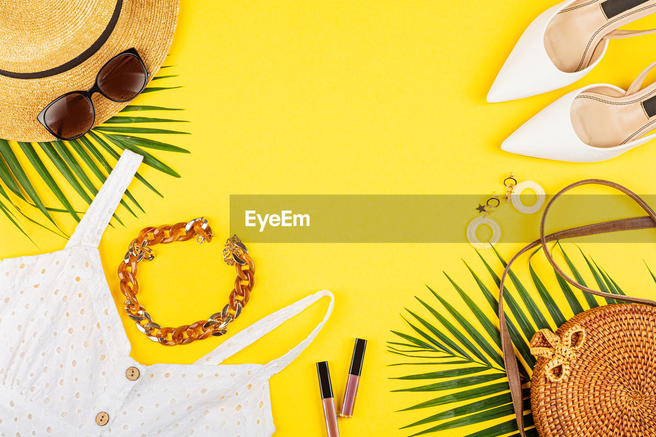 yellow, no people, high angle view, food and drink, food, still life, fashion accessory, table, colored background, nature