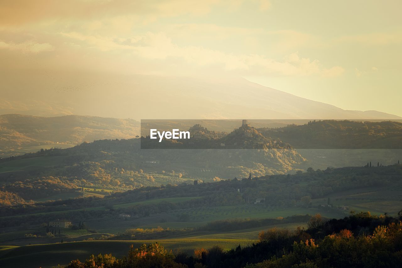 Scenic view of landscape against sky during sunset