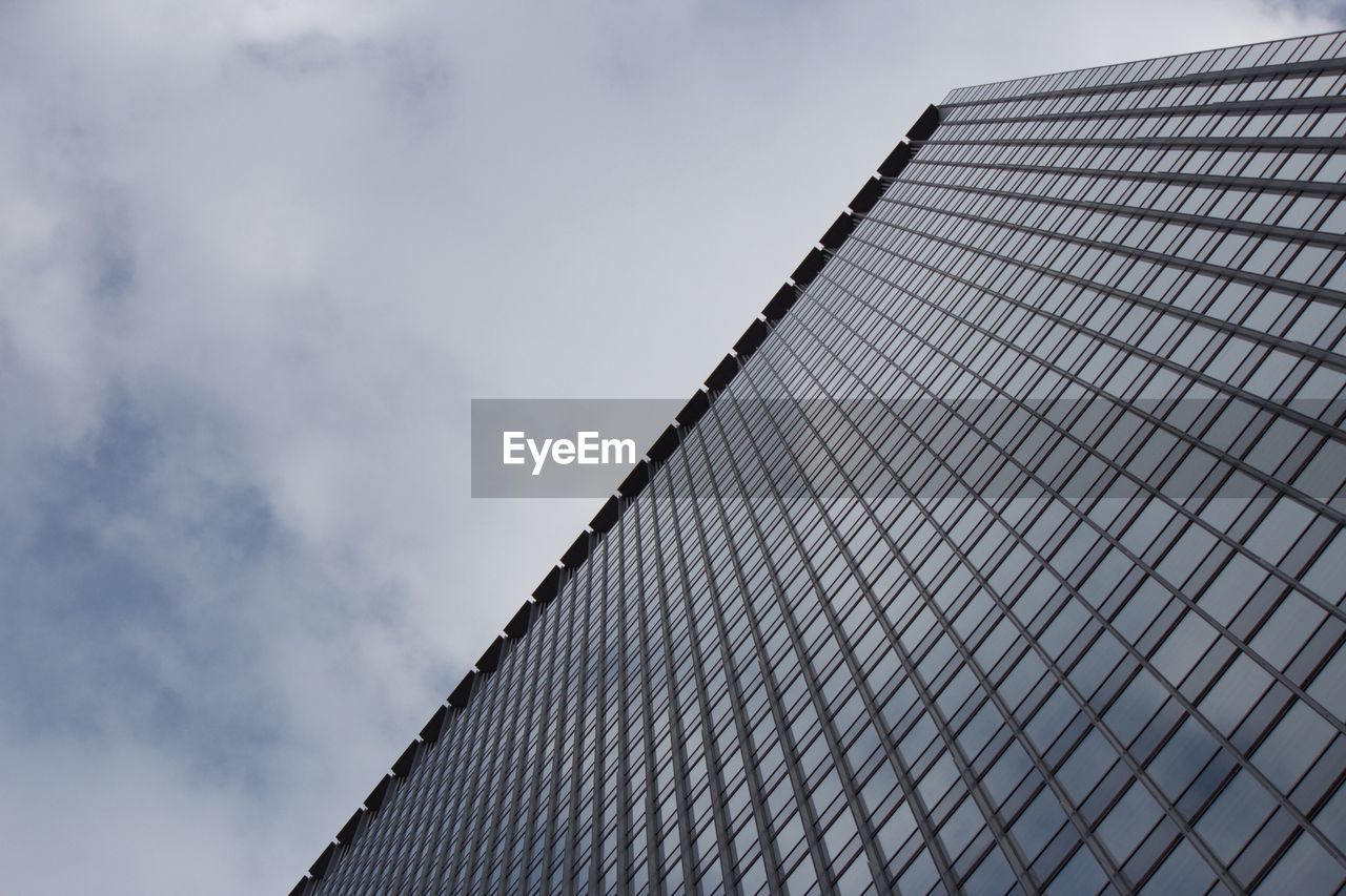 LOW ANGLE VIEW OF MODERN BUILDINGS AGAINST SKY