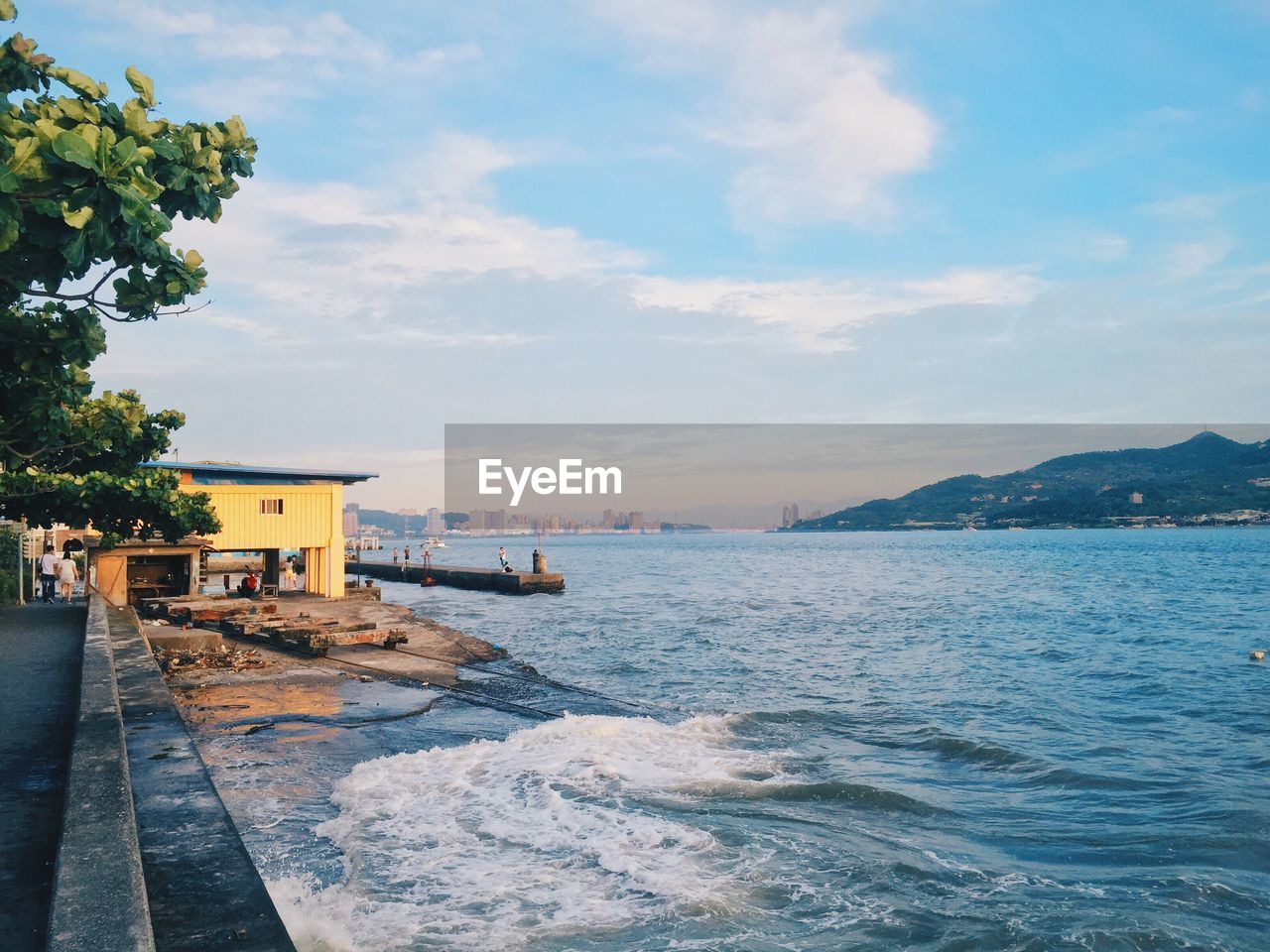 Scenic view of sea against cloudy sky