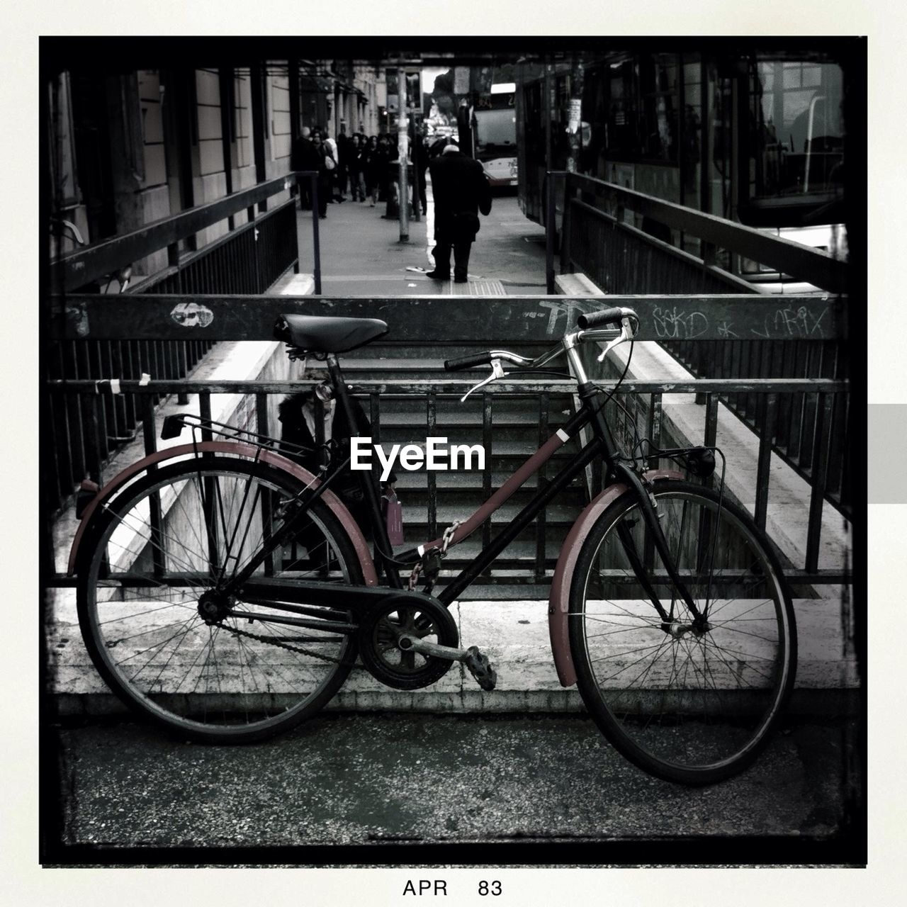 Bicycle parked by railing in city