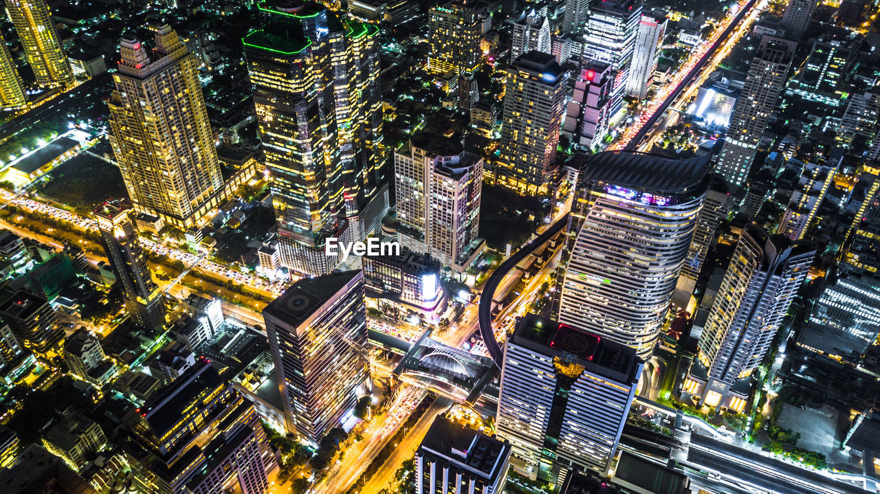 High angle view of city lit up at night