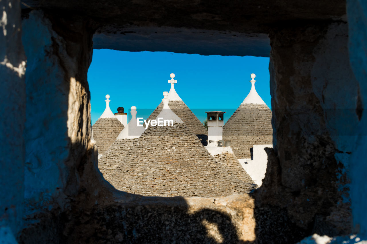 Group of beautiful trulli, traditional apulian dry stone hut old houses with a conical roof