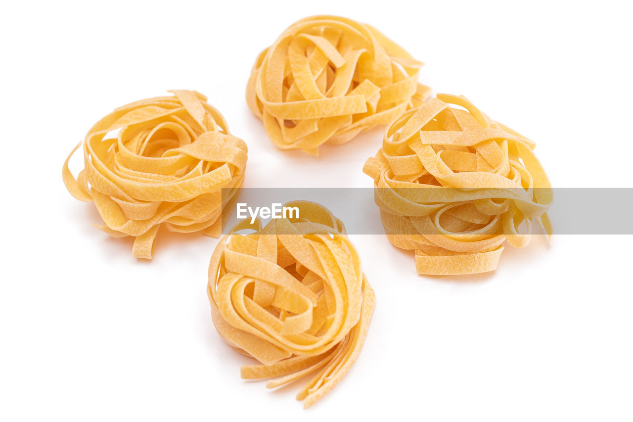 high angle view of red chili peppers against white background