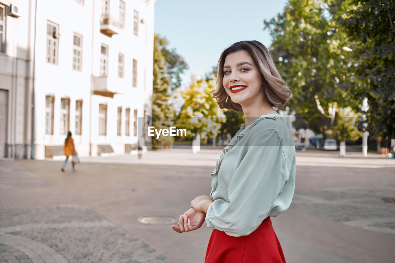 Full length of woman standing in city