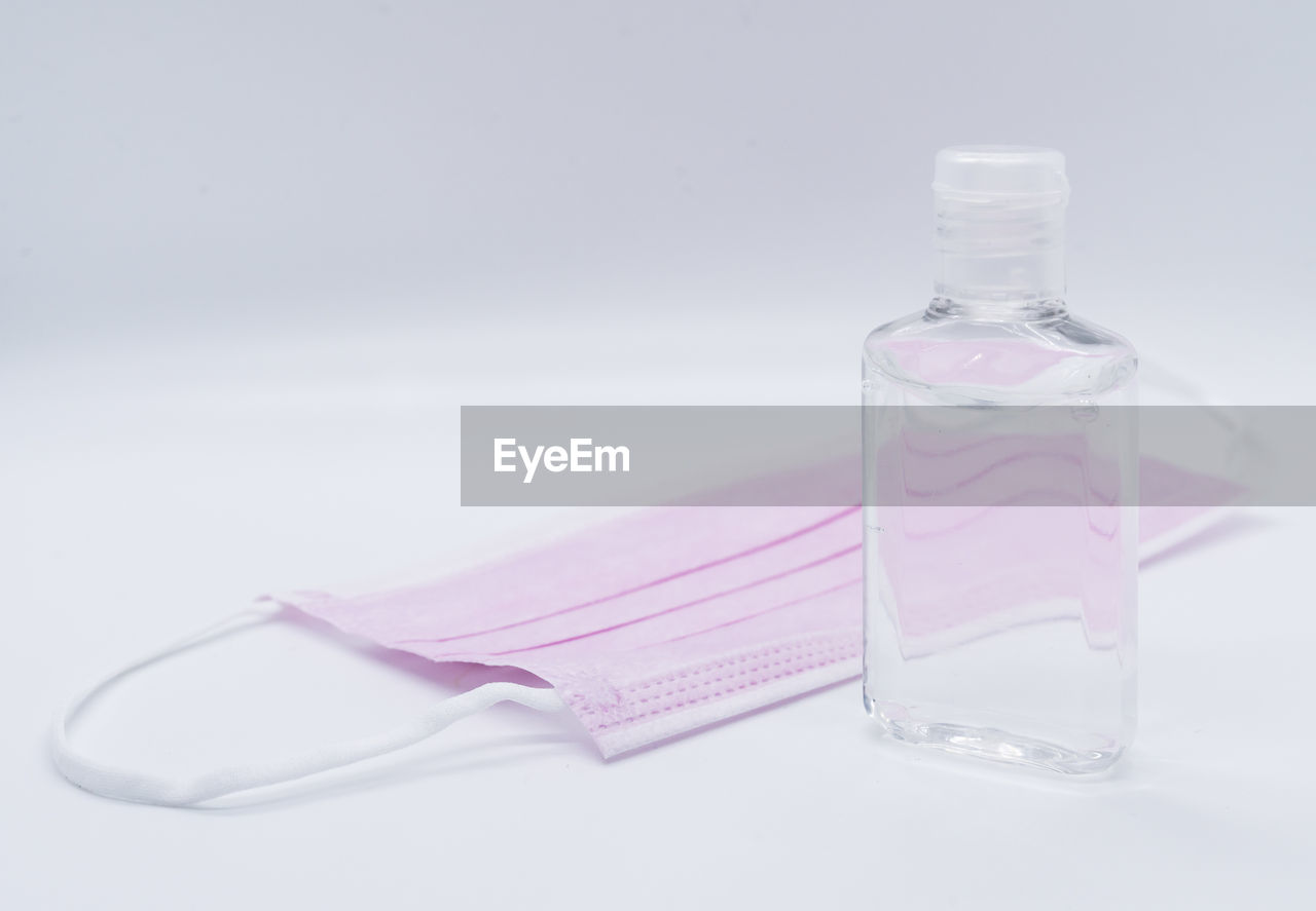 CLOSE-UP OF WATER BOTTLE ON TABLE