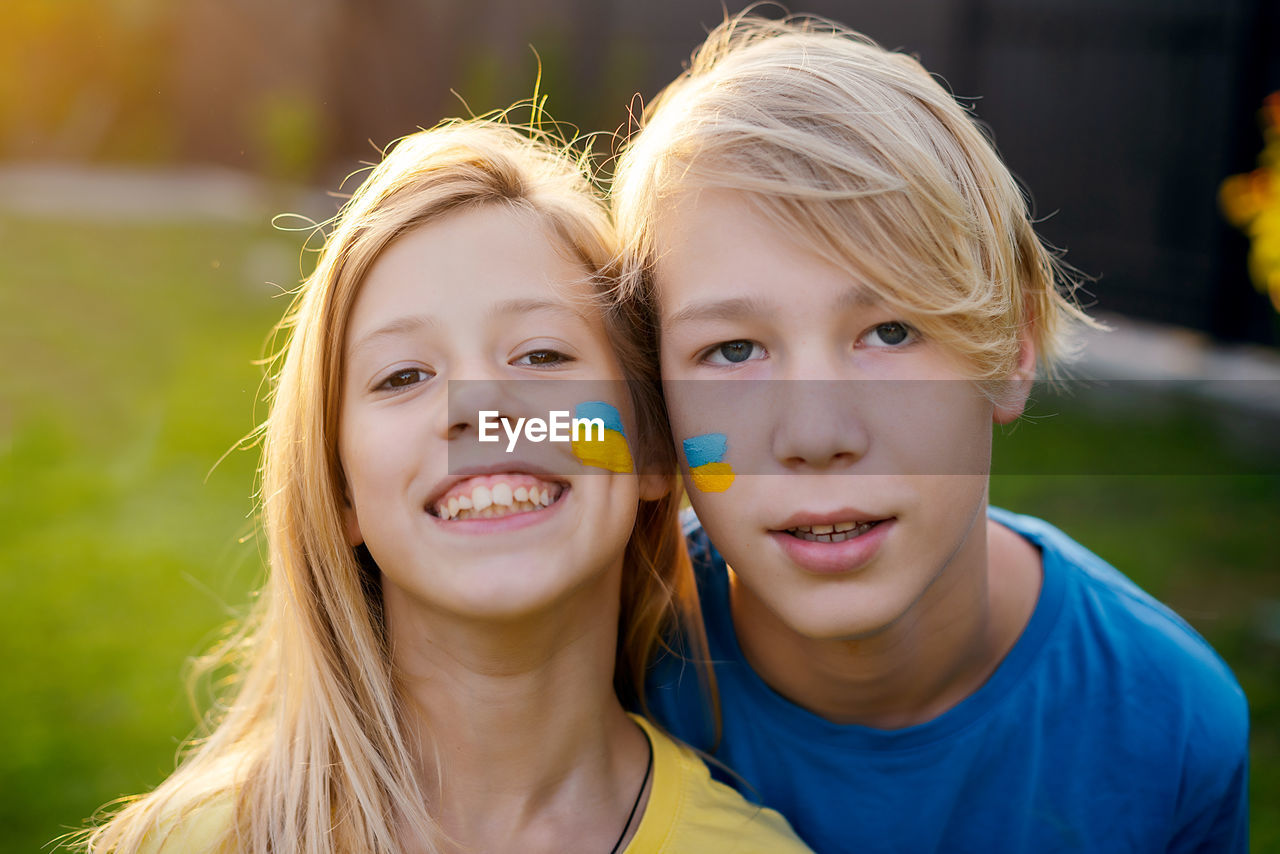 Brother and sister with ukrainian flag 