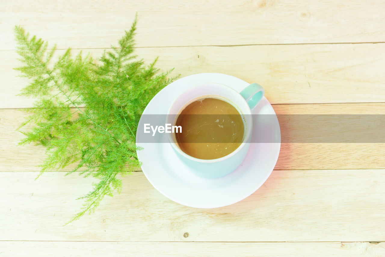 High angle view of coffee in cup on table