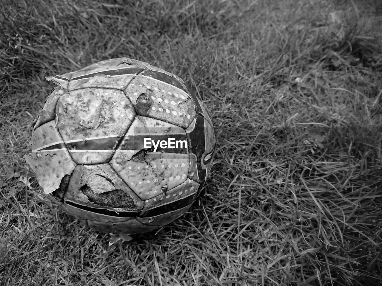 CLOSE-UP OF BALL ON SOCCER FIELD