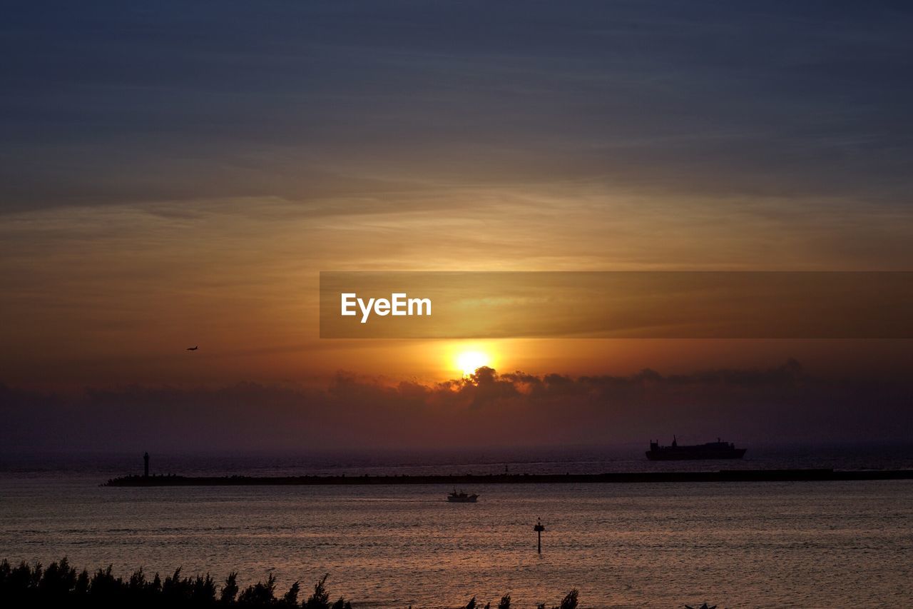 Scenic view of sea at sunset