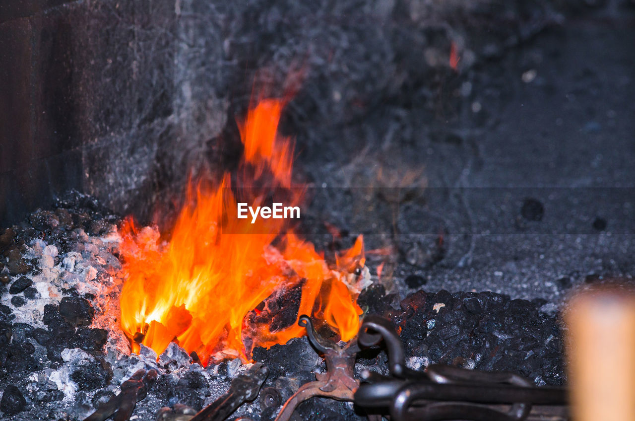 High angle view of fire burning in blacksmith shop