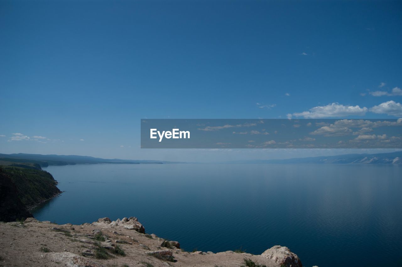 Scenic view of sea against blue sky