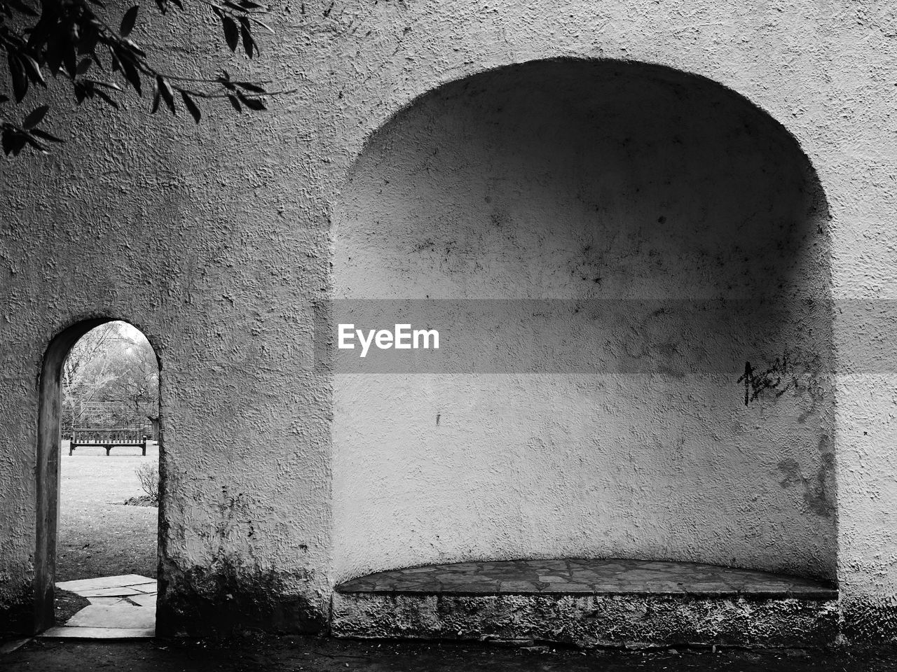 Park seen through from arch of building