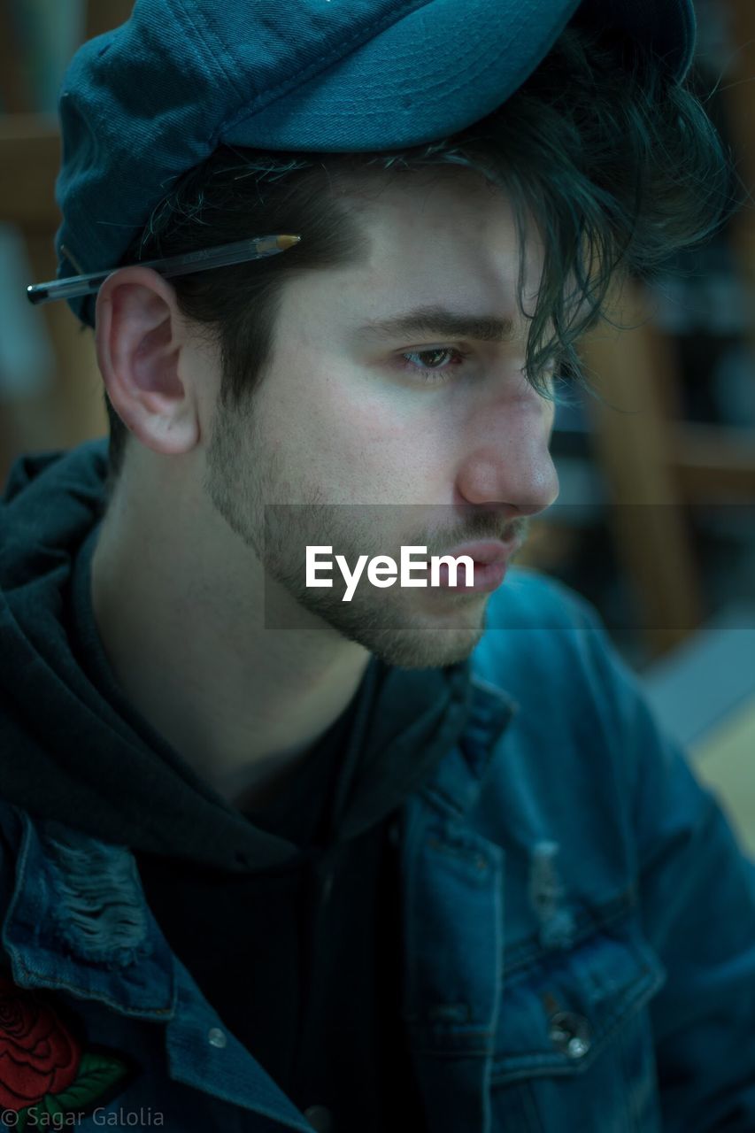 Close-up of thoughtful young man