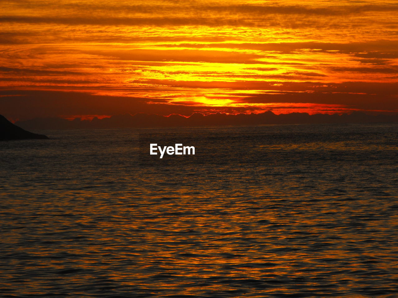 Dramatic sky over sea during sunset