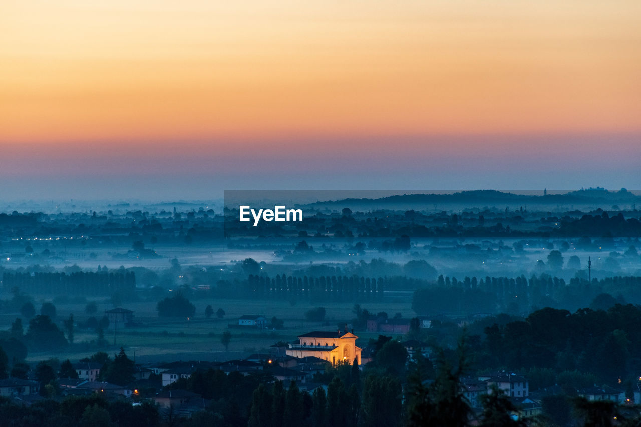 Scenic view of landscape against sky during sunset