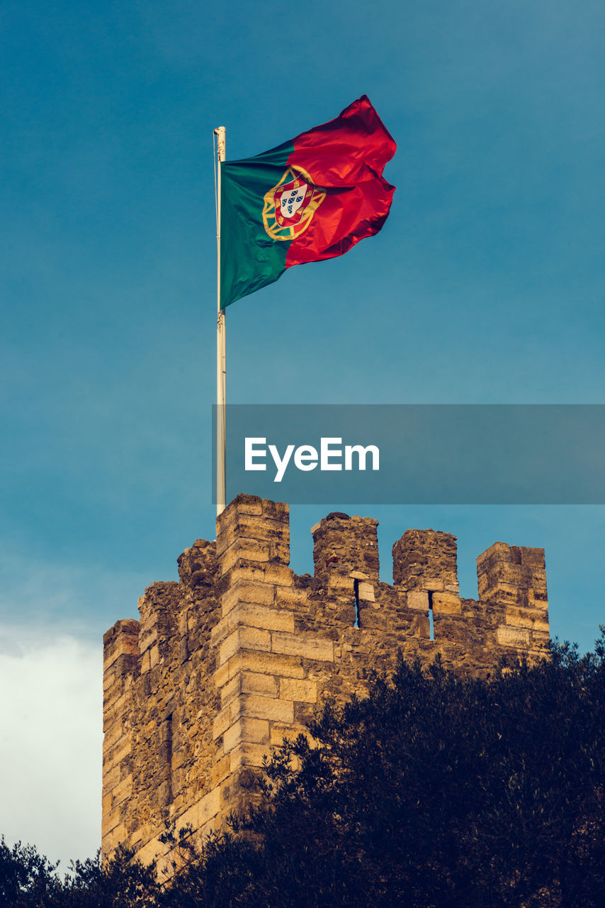 Portuguese flag at the old castle castelo sao jorge in lisbon, portugal