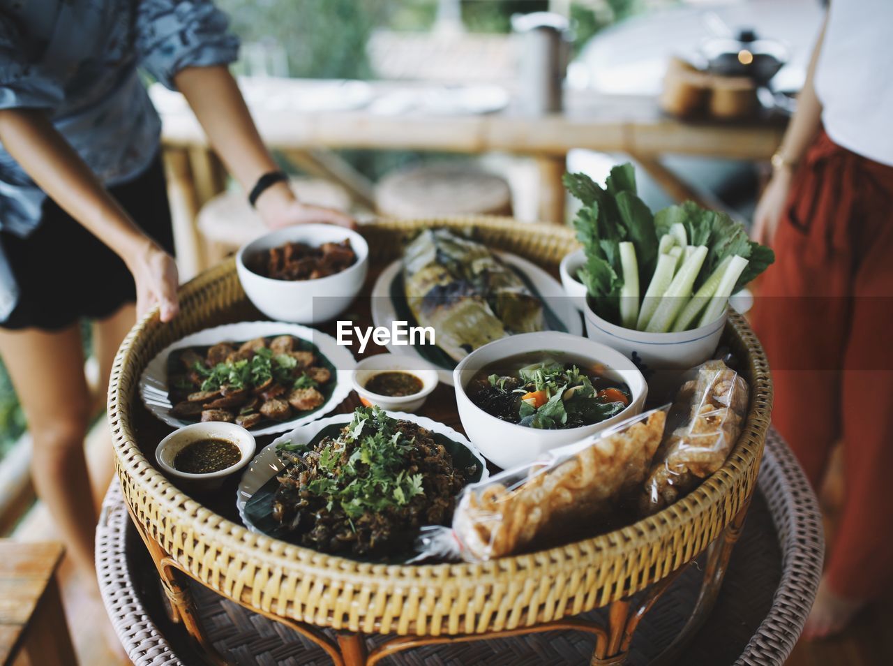 Midsection of woman with various food