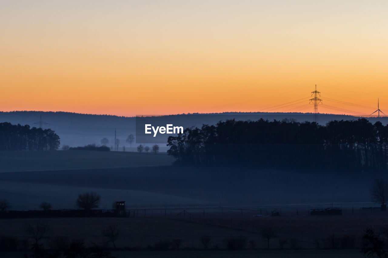 Scenic view of silhouette landscape against sky during sunset