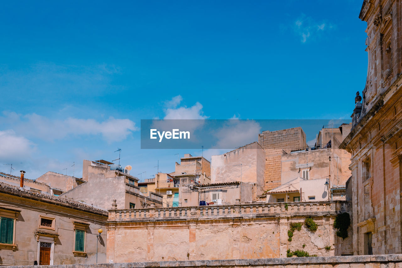 Architecture of scicli with sky with white clouds