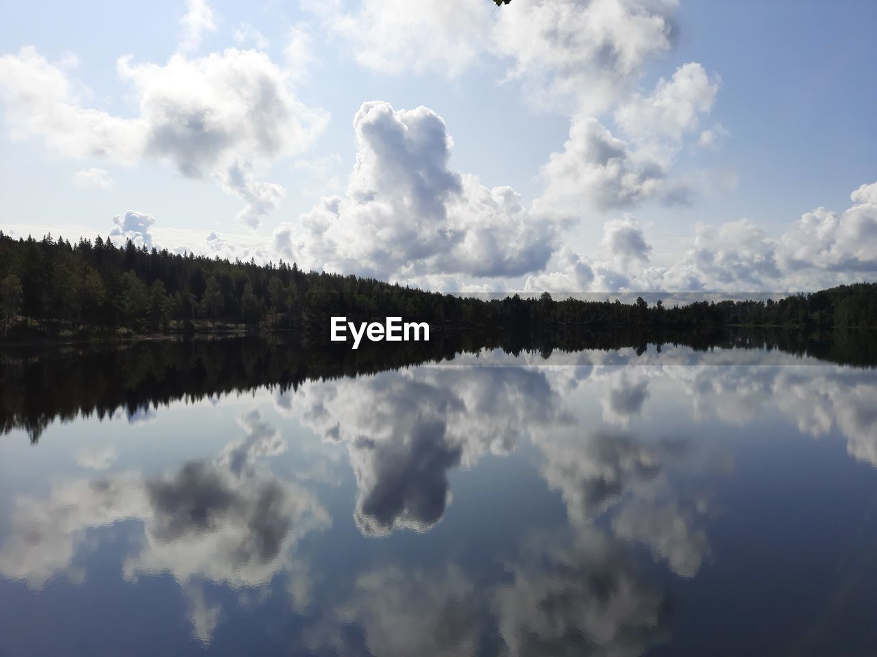 REFLECTION OF CLOUDS IN LAKE