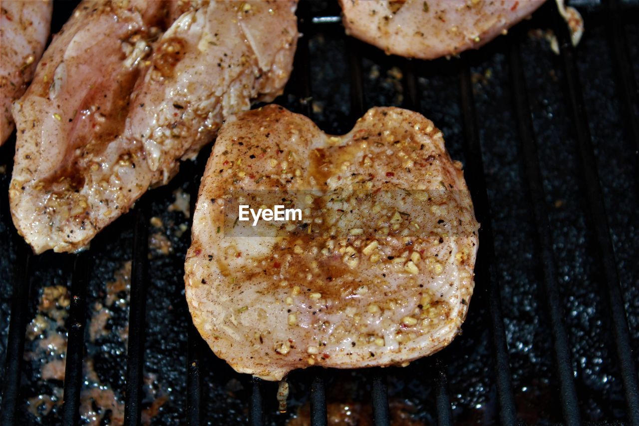 High angle view of chicken on barbecue grill