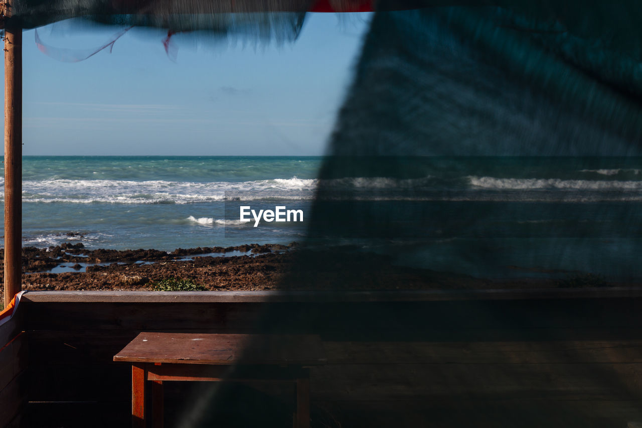 Old wooden gazebo on the beach