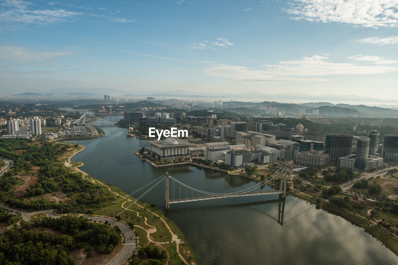 Aerial view of river against cityscape