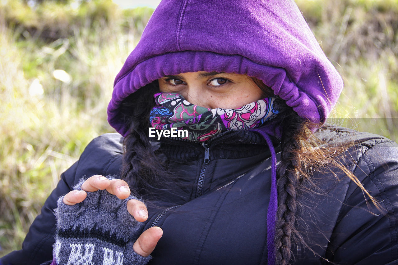 Close-up portrait of woman in warm clothing