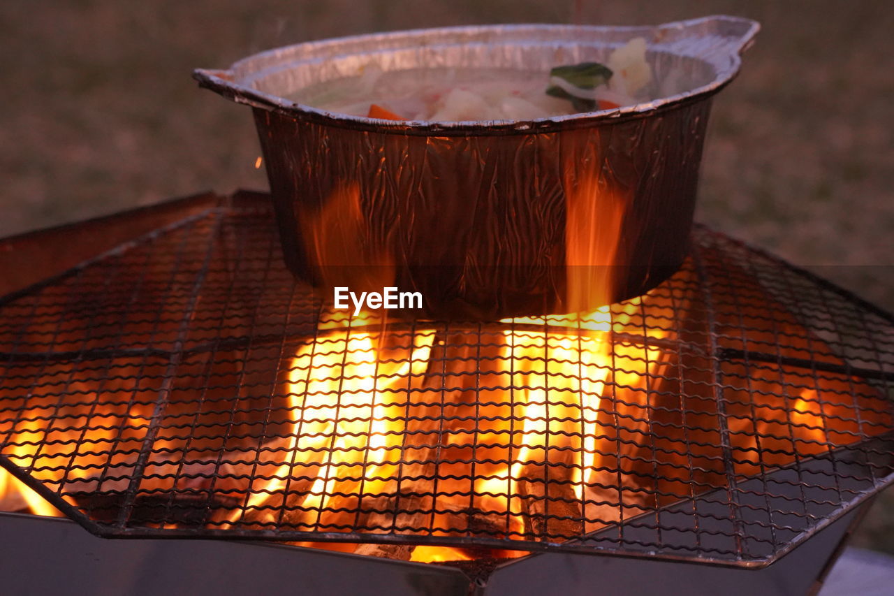 Close-up of fire on barbecue grill