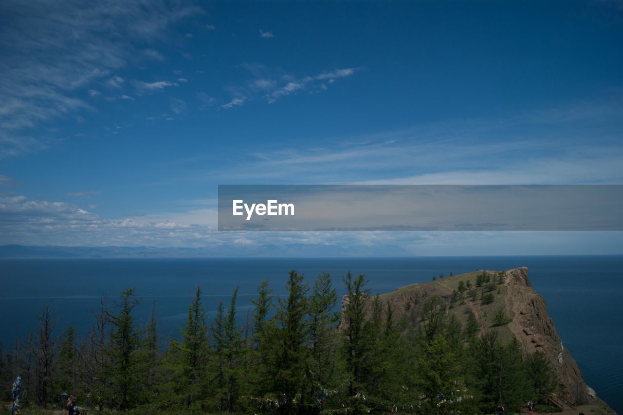 Scenic view of sea against blue sky