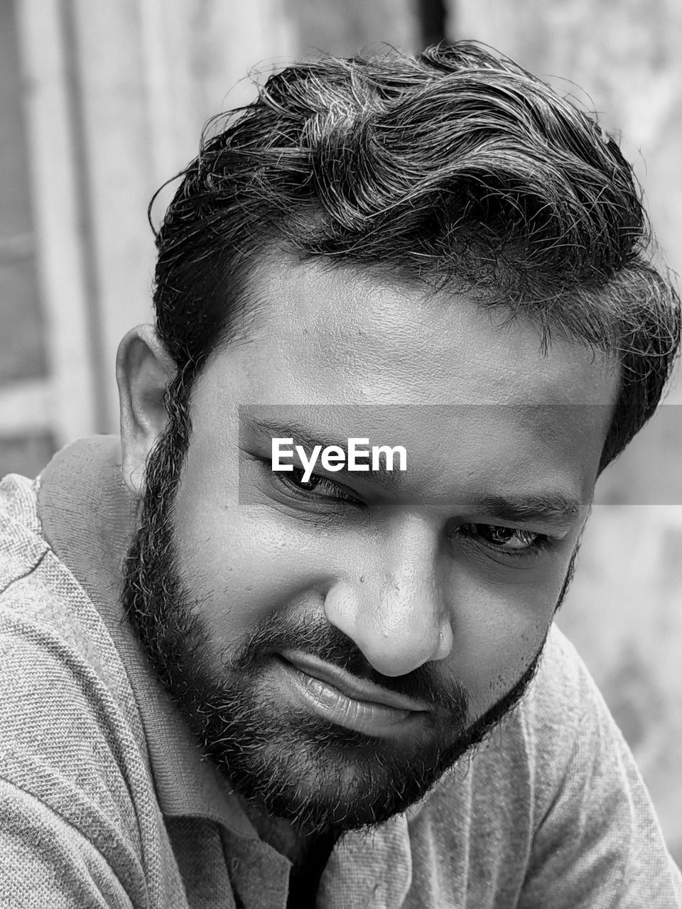 portrait, one person, headshot, men, portrait photography, black and white, beard, adult, person, human hair, facial hair, young adult, monochrome photography, monochrome, human face, hairstyle, lifestyles, black, close-up, smiling, front view, emotion, looking at camera, casual clothing, white, focus on foreground, leisure activity, happiness, day, human head, looking, outdoors, human eye, contemplation