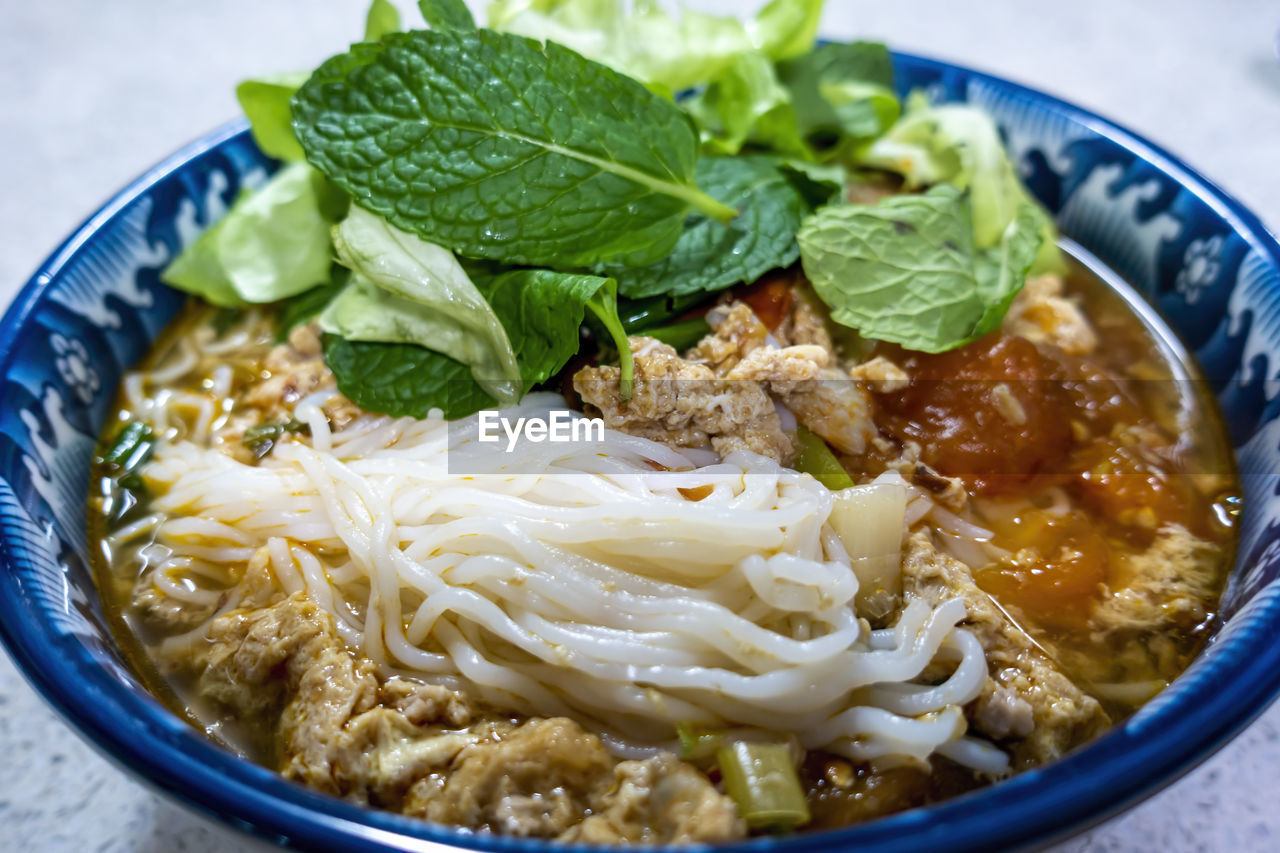 CLOSE-UP OF NOODLES WITH RICE IN BOWL