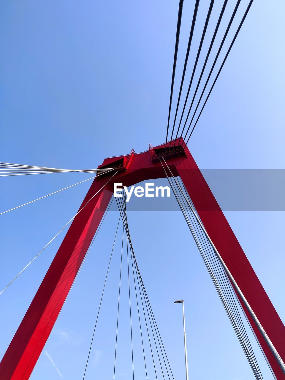 LOW ANGLE VIEW OF SUSPENSION BRIDGE AGAINST CLEAR SKY