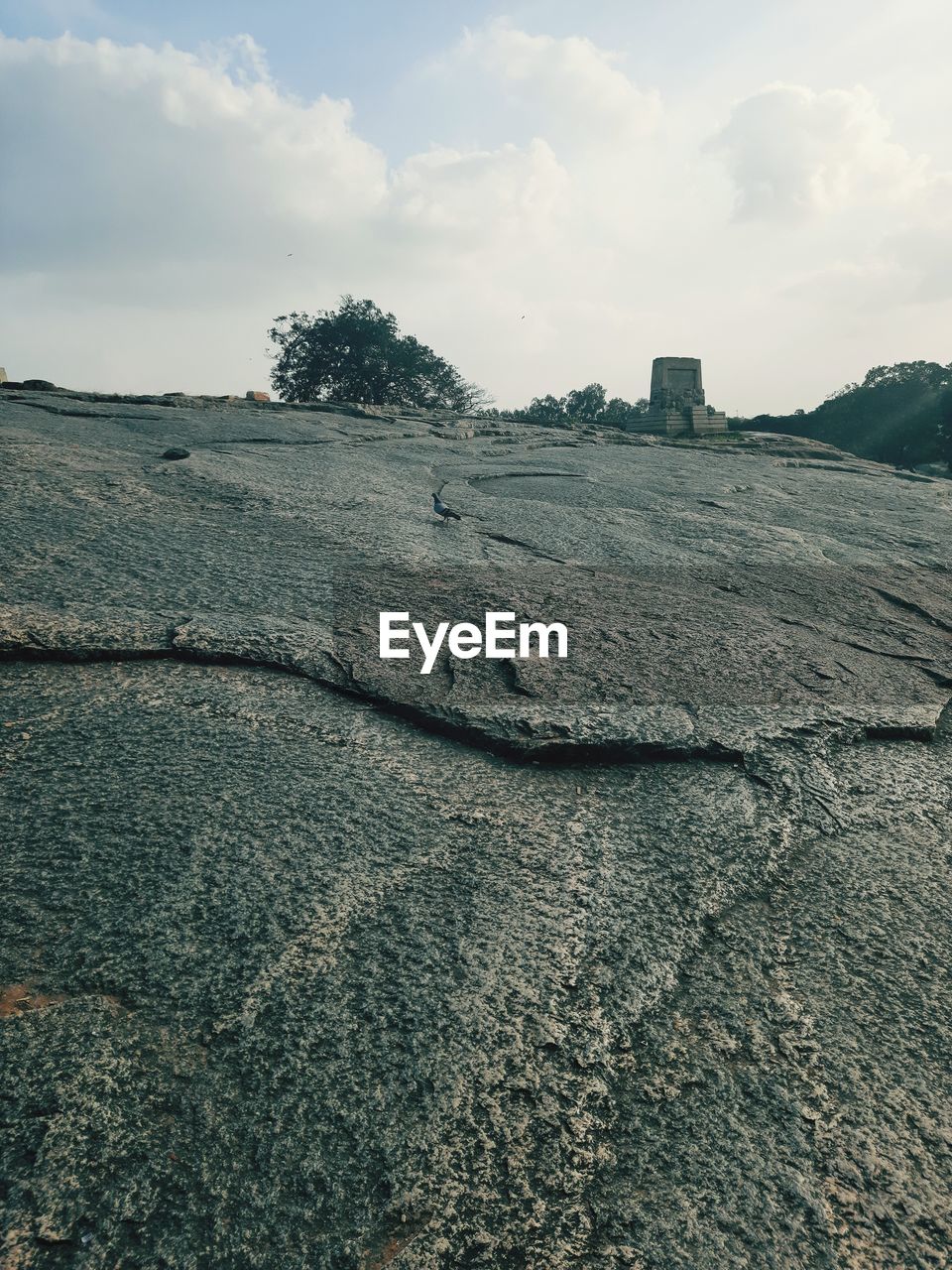 Scenic view of rocky beach against sky