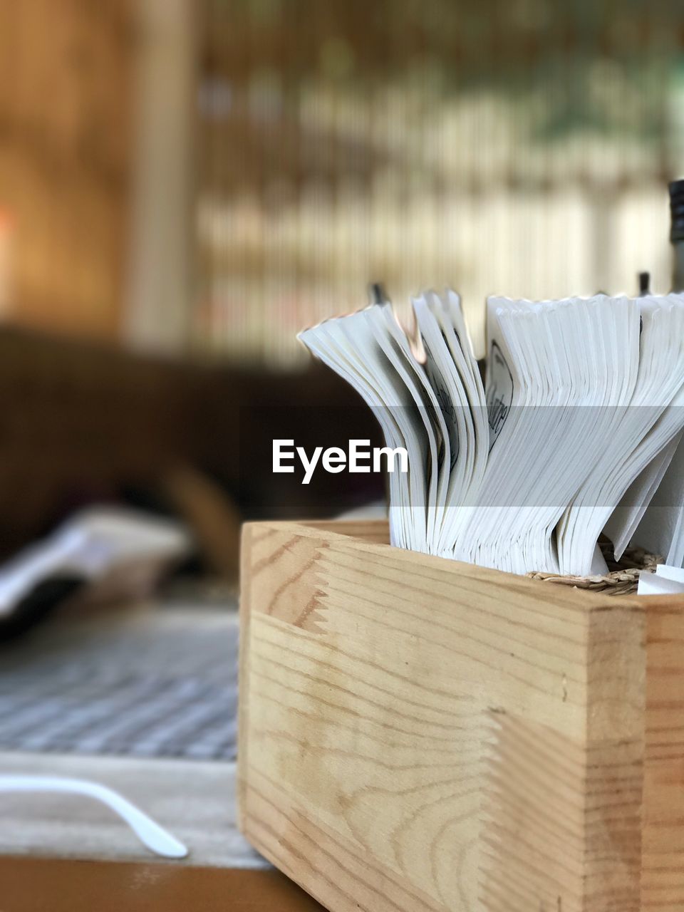 CLOSE-UP OF BOOKS ON BOOK