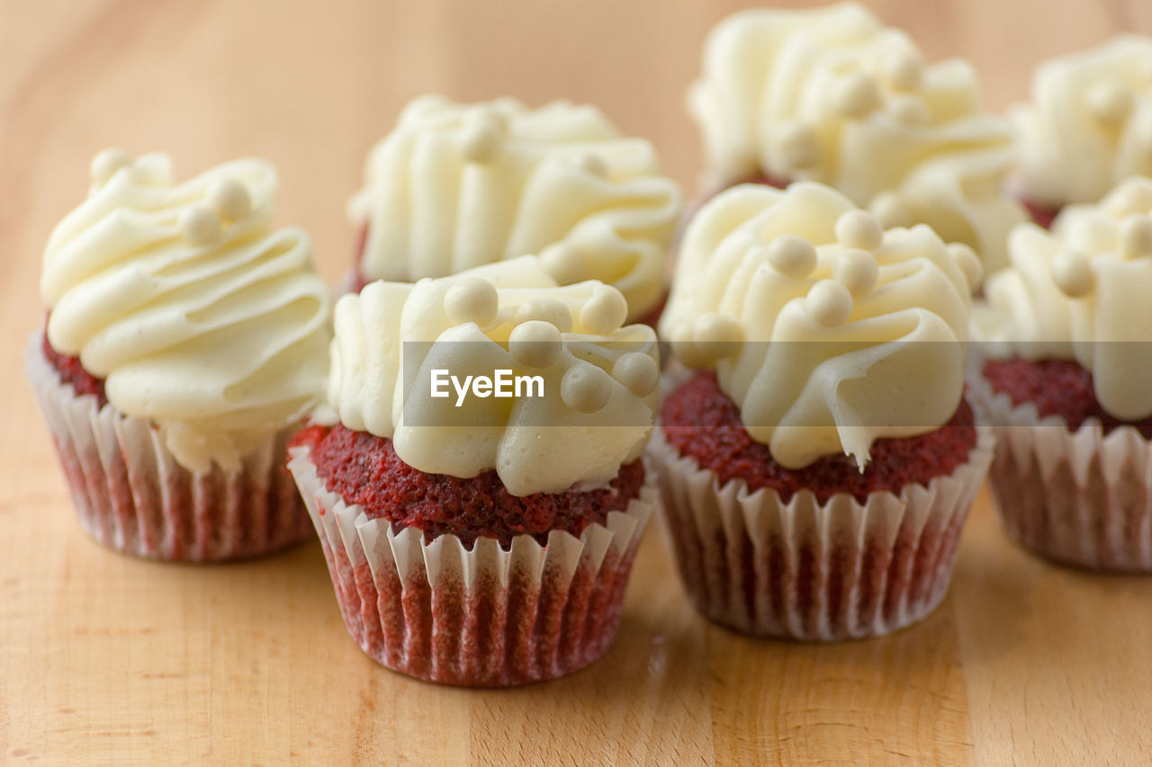 Mini red velvet cupcakes elegantly decorated.