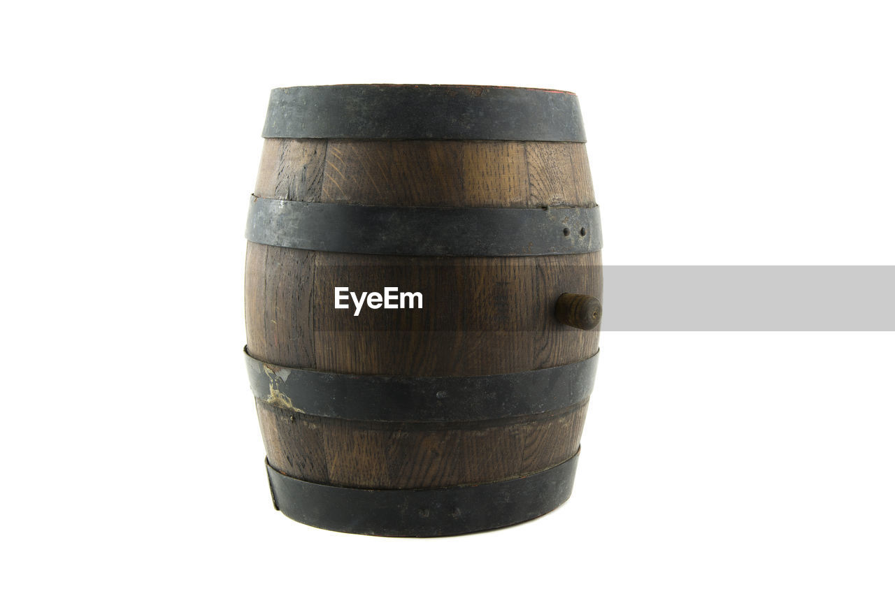 Antique wooden barrel against white background