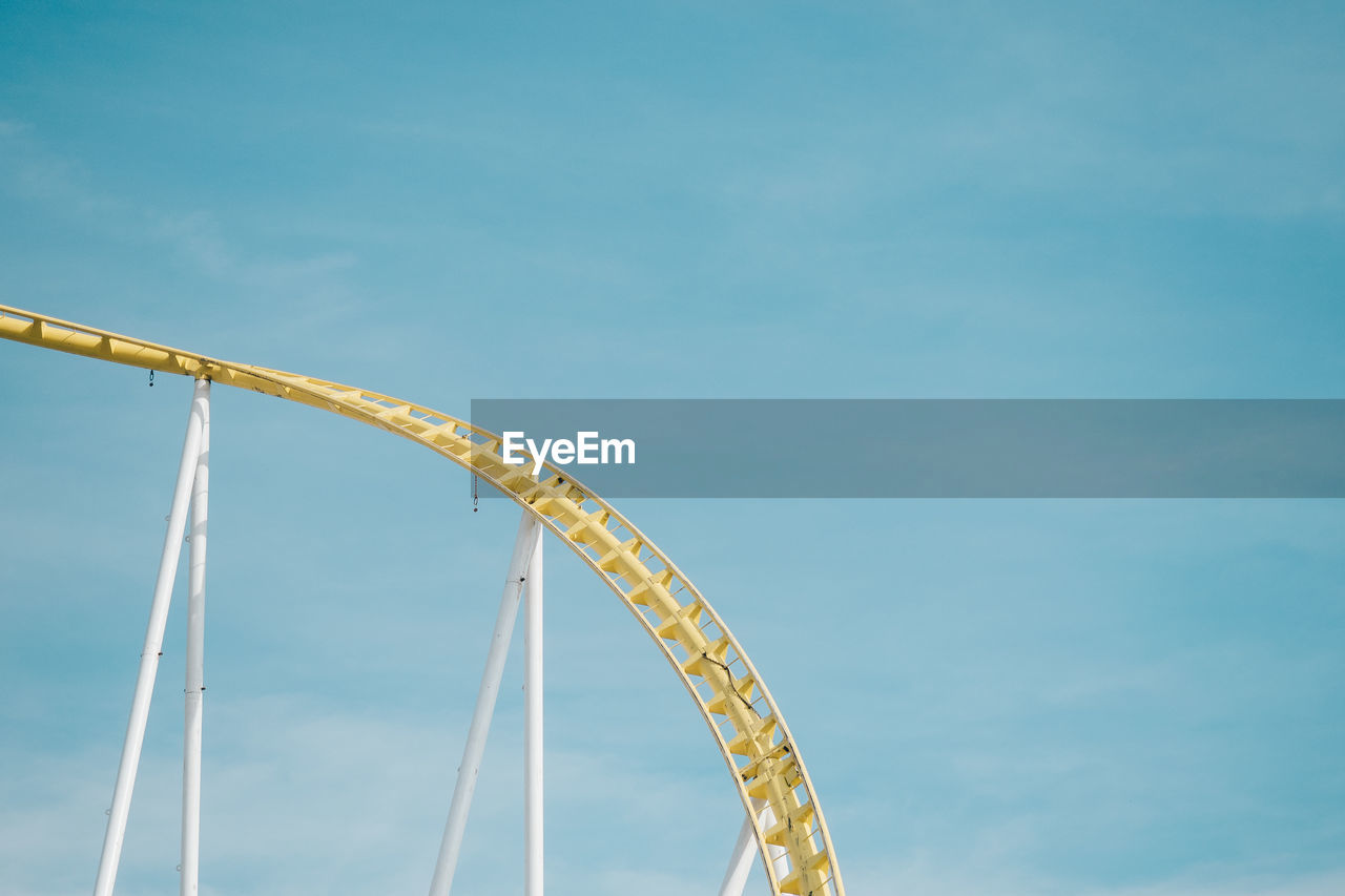 Low angle view of rollercoaster against sky