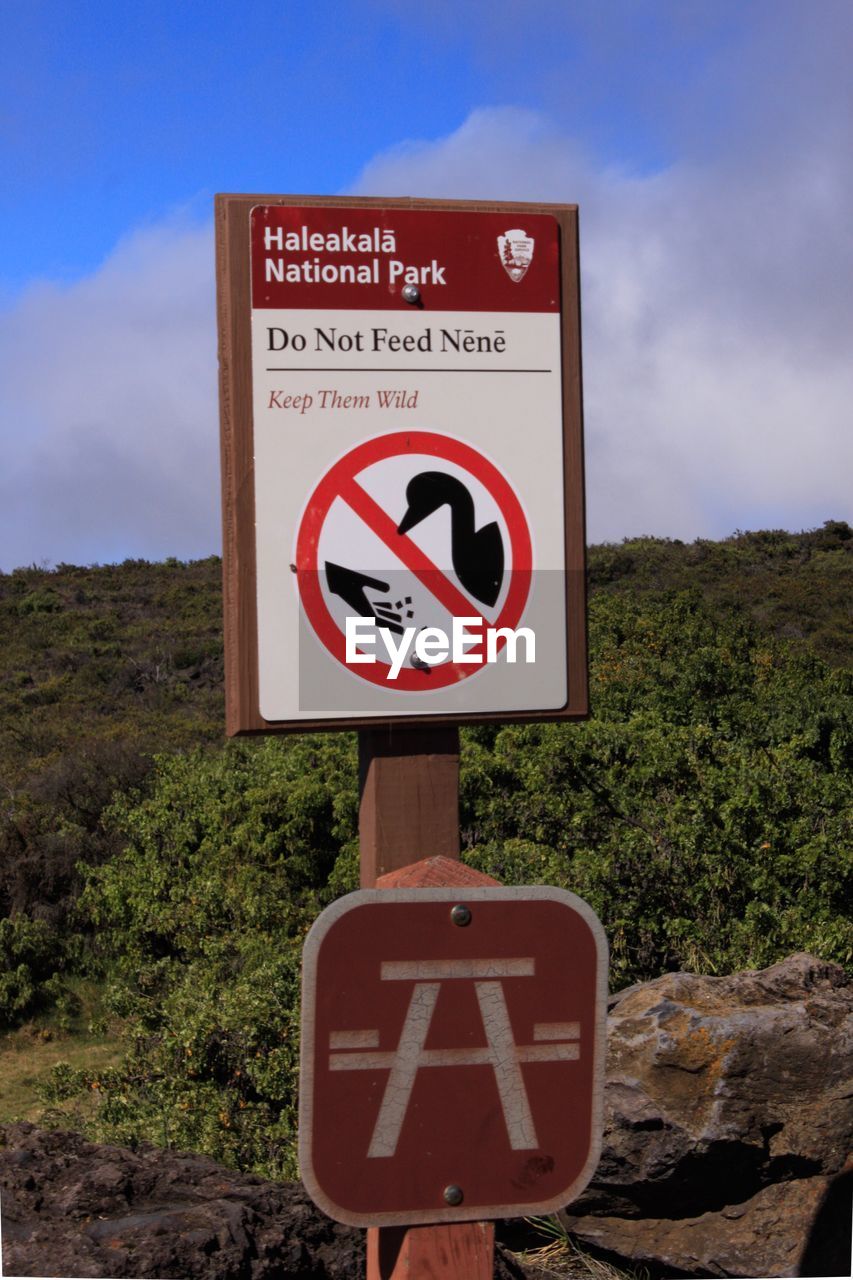 INFORMATION SIGN ON ROAD BY THE GROUND