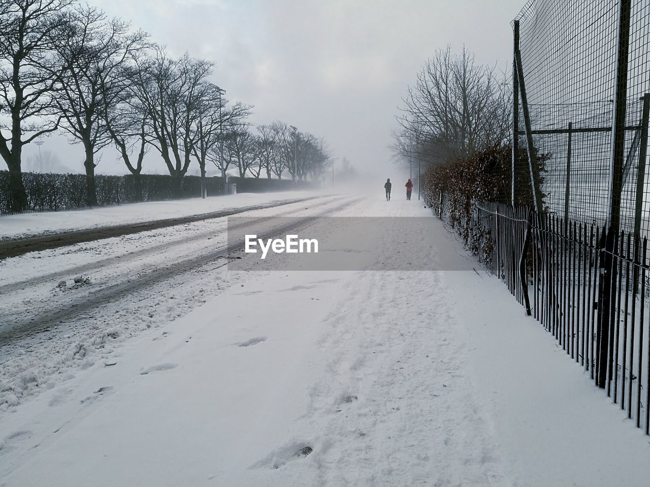 Snow covered landscape against sky