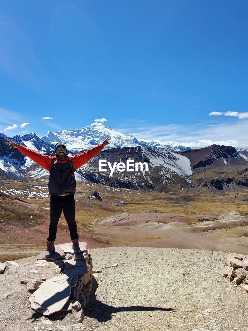 Full length of person on snowcapped mountain against sky