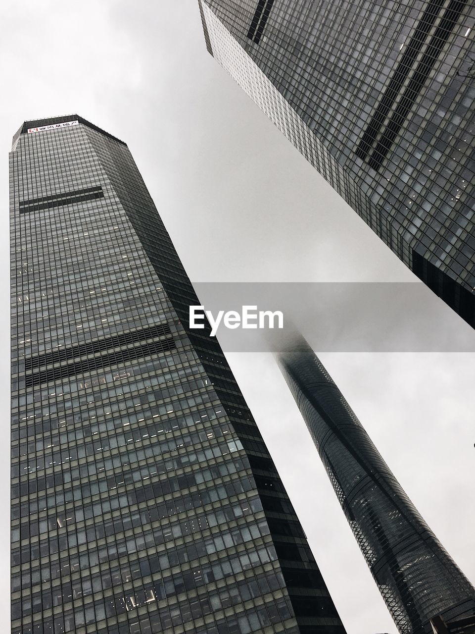 Low angle view of buildings in city against sky