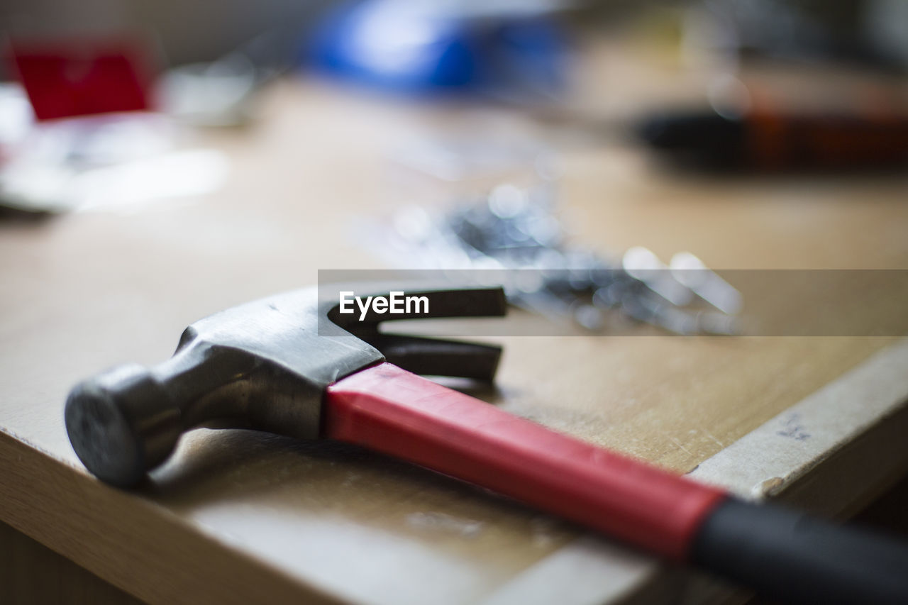 Close-up of hammer on table