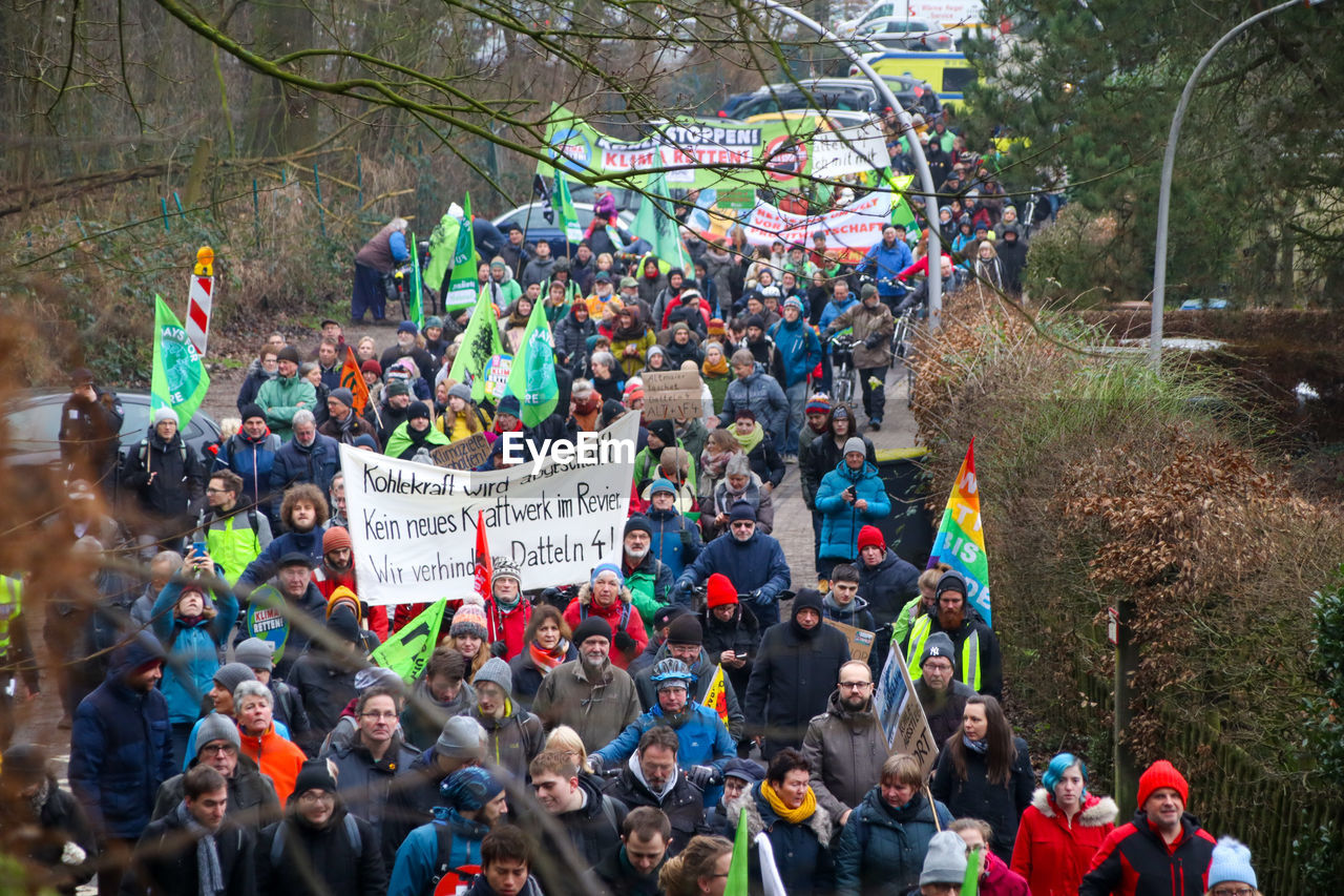 High angle view of people protesting on street