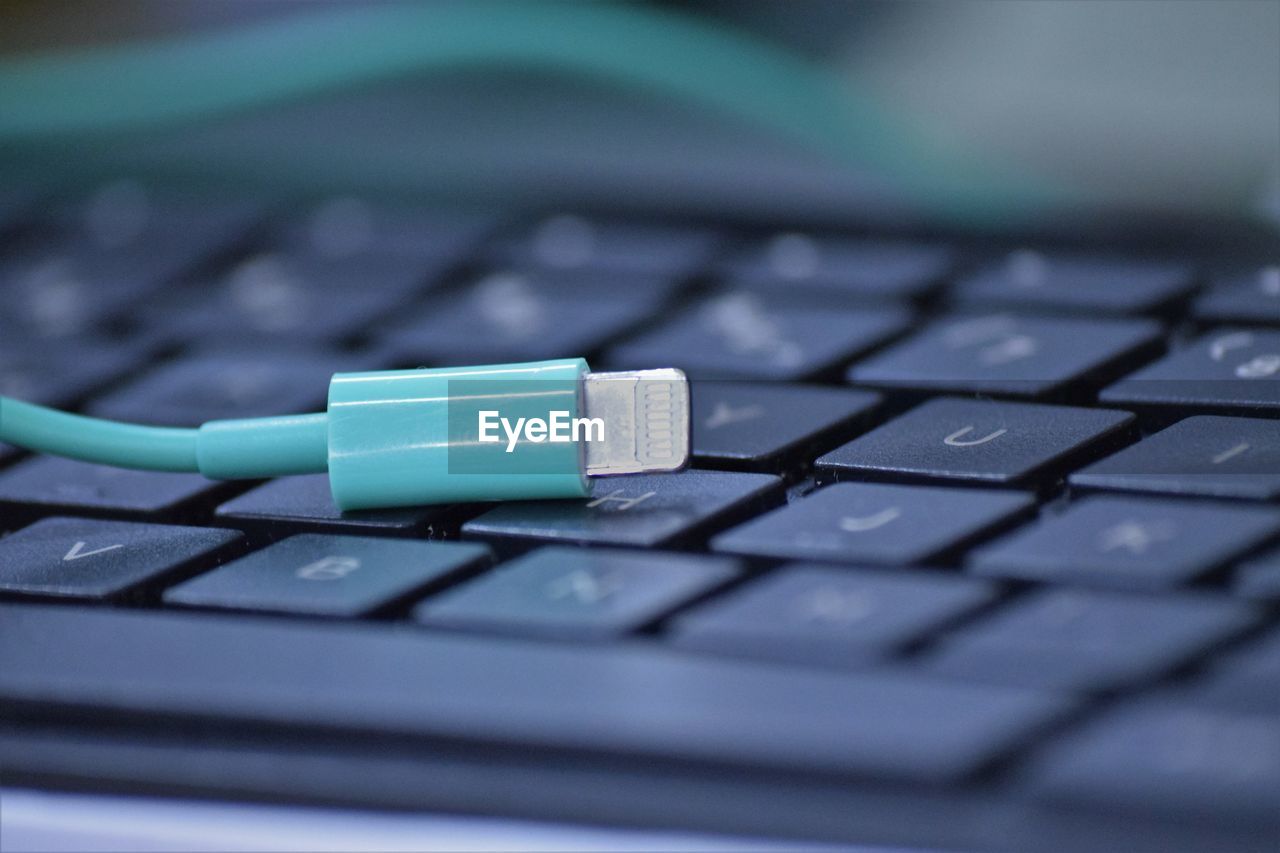 Close-up of usb cable on keyboard