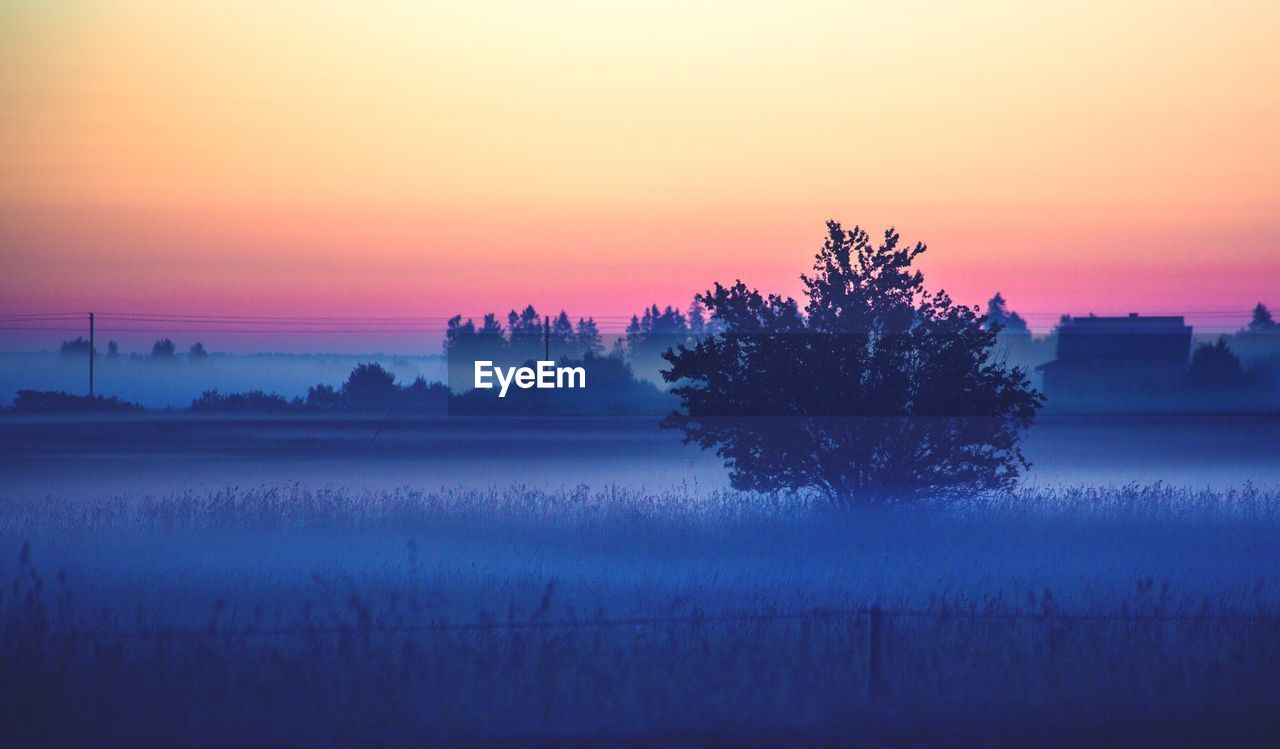 Scenic view of landscape at sunset