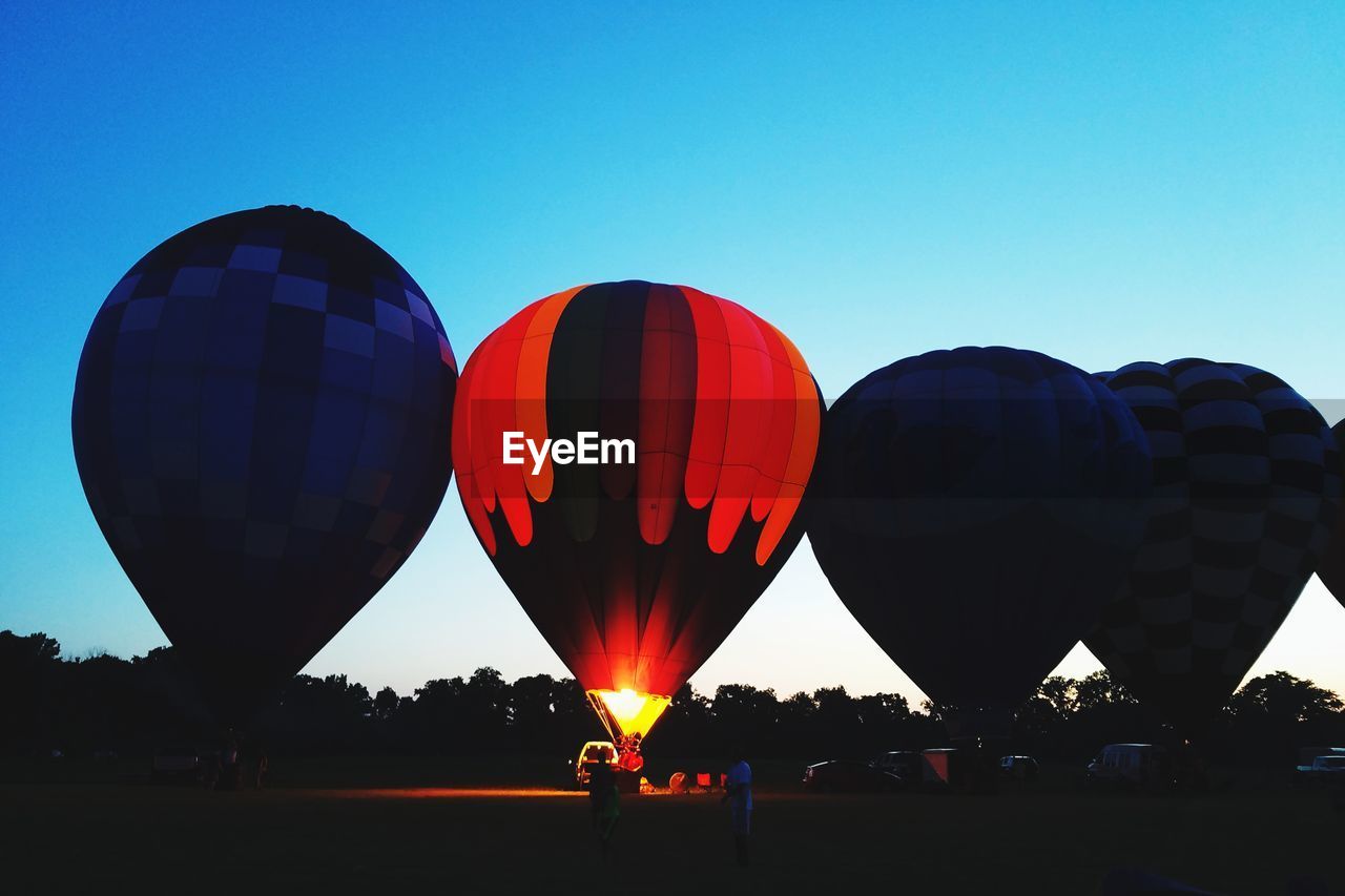 VIEW OF HOT AIR BALLOONS AGAINST BLUE SKY